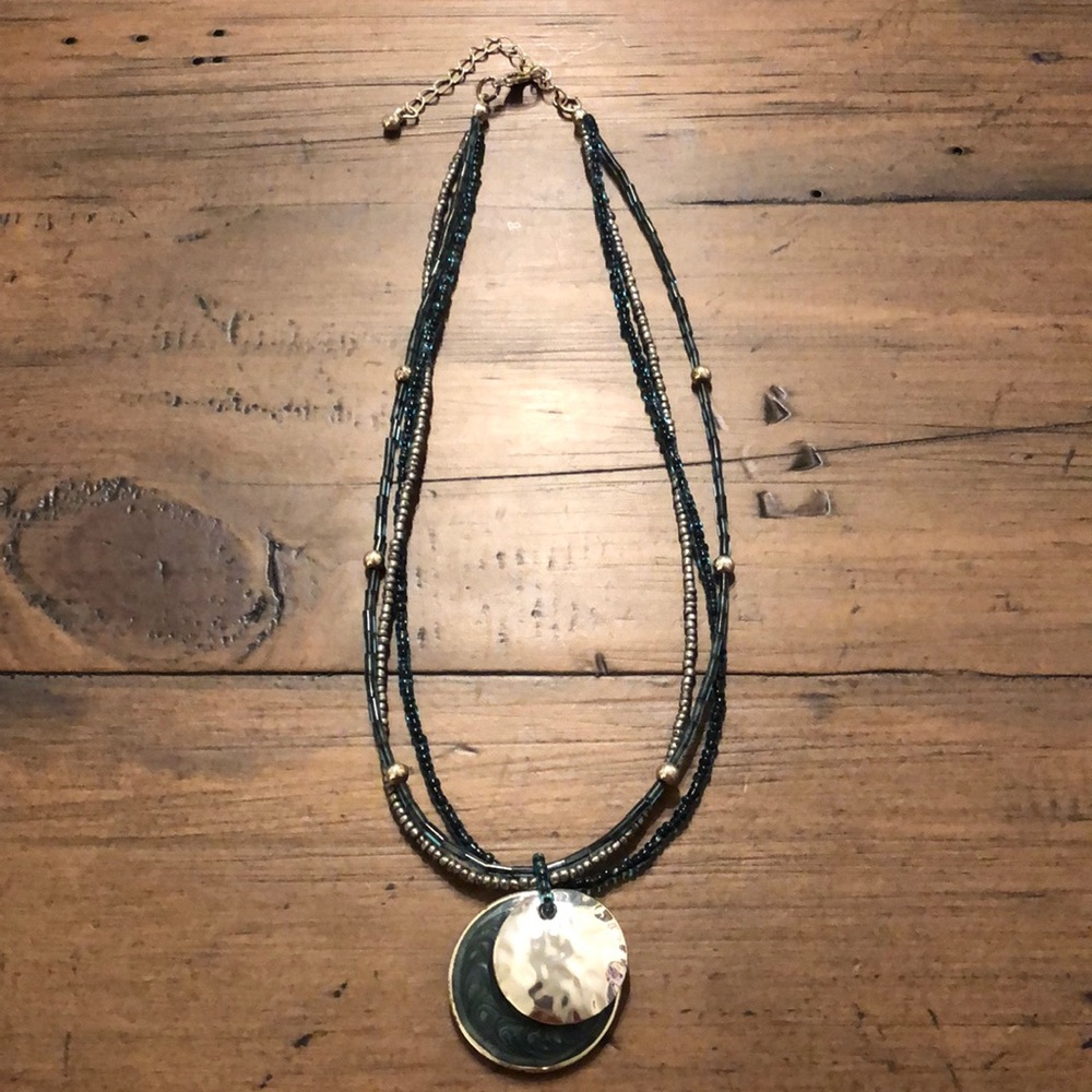 Teal beaded necklace with teal and silver pendant